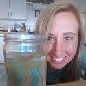 Katlyn poses with a jelly fish in a jar.